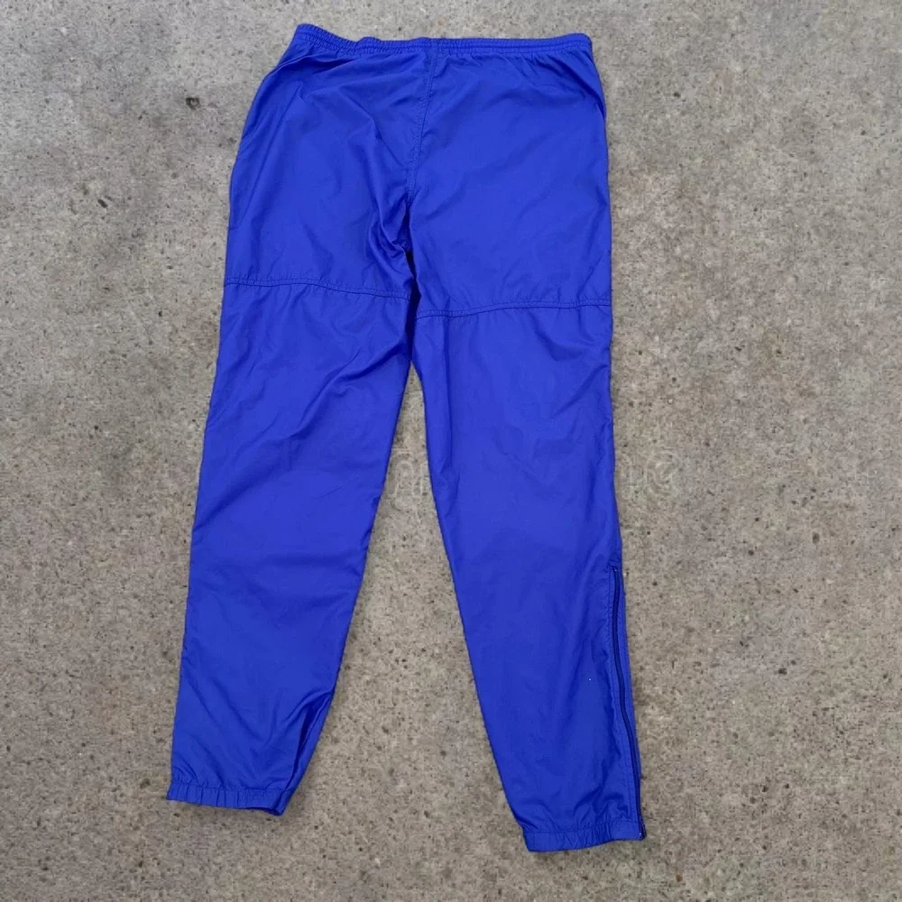 Vintage Y2K Era Nike Medium Royal Blue Nylon Windbreaker Track Pants 2007 Mens